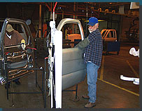 Students learning to repair door dings